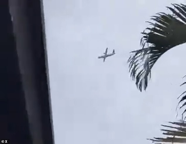 The plane can be seen in a 'death spiral' before it crashed into a residential area on Friday