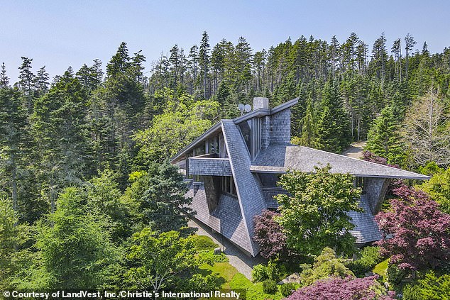 An enchanting Frank Lloyd Wright-inspired Maine home overlooking the rugged coast has hit the market for $5 million (pictured)