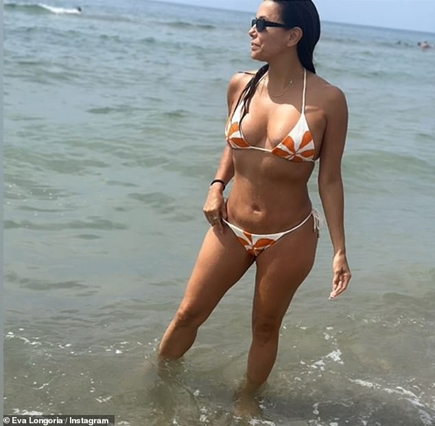 Eva Longoria showed off her incredible body in a skimpy bikini bottom as she relaxed in Marbella with her son Santiago on Monday