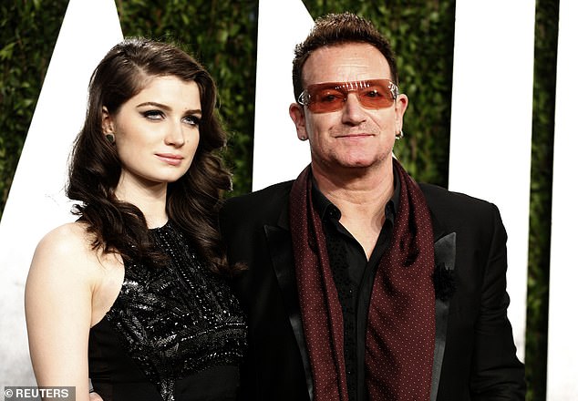 The actress is the daughter of U2 frontman Bono and businesswoman and activist Ali Hewson (pictured with Bono in 2013)