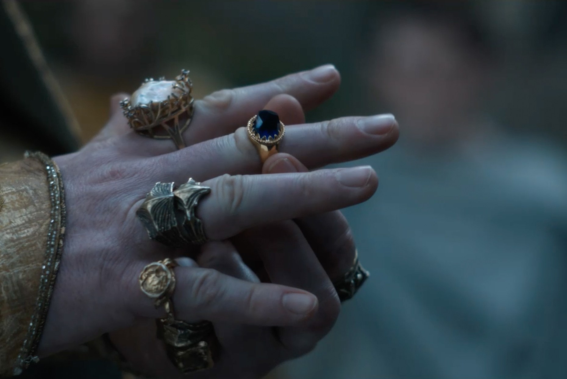 A photo of a blue elven ring on the hand of King Gil-galad