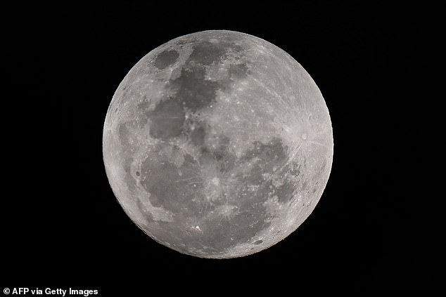 Stargazers are in for an exceptionally rare treat tonight as a blue supermoon lights up the Northern Hemisphere. Pictured is the blue supermoon over Sydney today