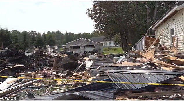 The male homeowner was hospitalized after the massive propane explosion (pictured). Neighbor Barabra Deschaine's home was also damaged by the explosion