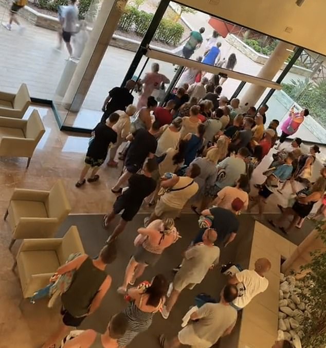 Dozens of British tourists waited eagerly at the door before rushing to a hotel in Spain to grab the best poolside loungers