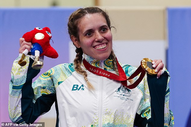 Australia's Amanda Reid on the podium after winning gold in the C1-3 500m time trial