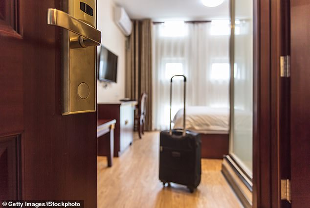 Her routine starts with holding the door open with a suitcase while she checks the room