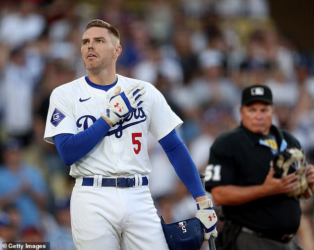 Freeman receives applause from fans at the plate as he returns to the lineup