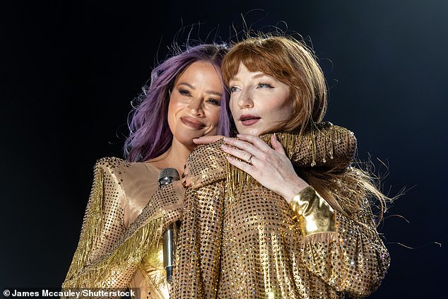 Girls Aloud's Nicola Roberts is engaged! The singer, 38, flashed her huge diamond ring on stage at Brighton Pride this past weekend after her boyfriend Mitch Hahn popped the question (pictured with Kimberley Walsh)