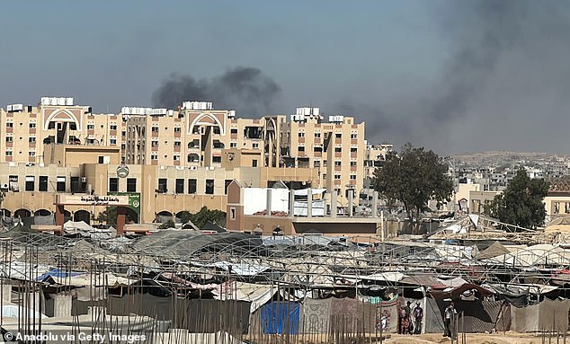 Hamas planned to exhume buried British and Commonwealth soldiers in Gaza in a bid to blackmail the government, newly discovered documents reveal (Pictured: Smoke rises after an Israeli raid on Khan Younis in Gaza)