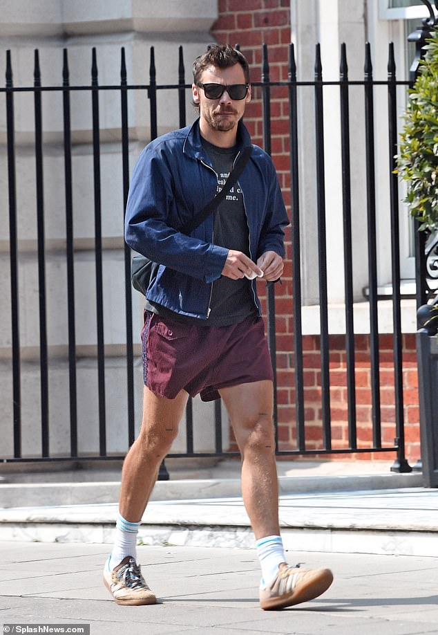 Harry Styles, 30, looked in good spirits as he took a stroll through London's Soho on Sunday amid speculation he will join his ex Taylor Swift on stage at her Wembley show on Monday.