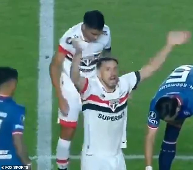 Players during a recent match in Sao Paulo call for an ambulance to come to Izquierdo's aid