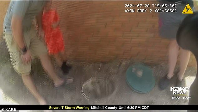 Heartbreaking body camera footage captured paramedics in Kansas desperately trying to save a 14-month-old boy who fell into a sump pump hole on Sunday