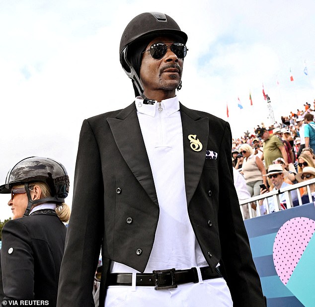 Snoop Dogg (pictured) wore pants, a dressage skirt and a helmet as he toured the Palace of Versailles