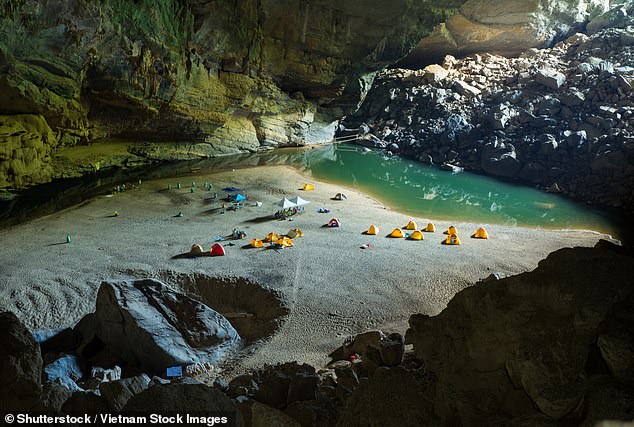 Laura Sharman remembers pitching her tent on the sandy shore of Son Doong Cave in Vietnam. She spent the first night of her six-day trek camping on the beach at Hang En Cave (file above)