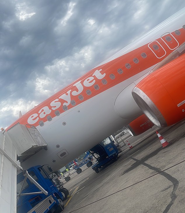 Flight EZY8120 is seen just before boarding the tarmac in Corfu under a gloomy sky