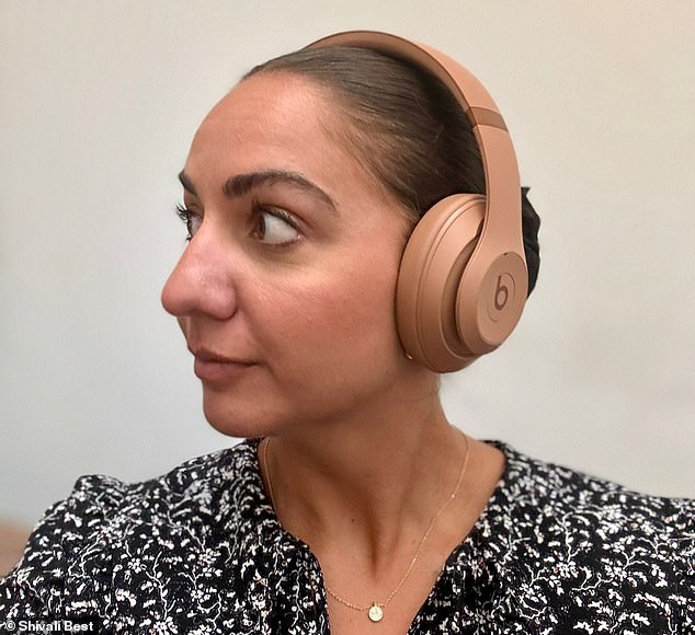 A colleague noticed that if you blur your eyes, the headphones almost make it look like there's a bald strip running across your head