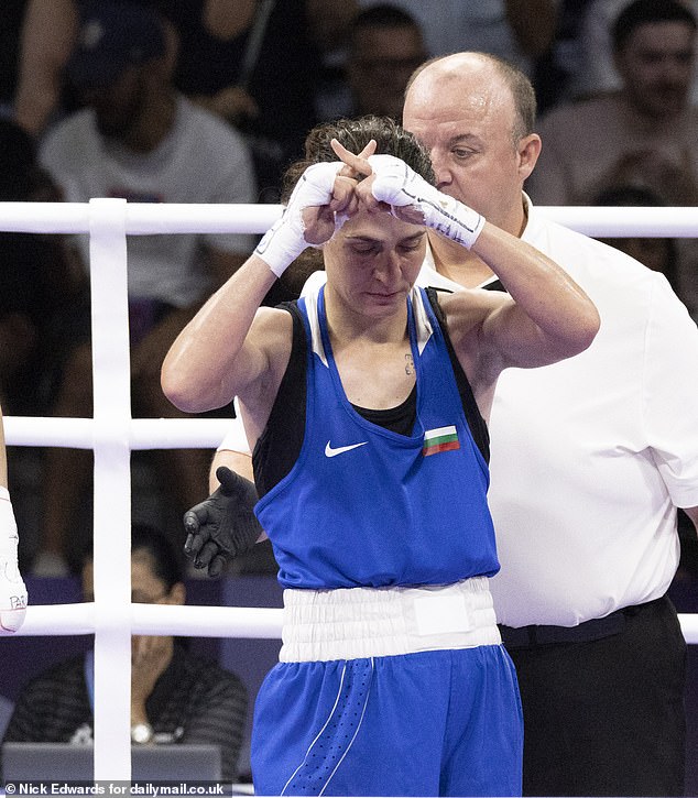 Bulgarian Svetlana Staneva crossed her fingers and tapped them twice at the crowd after the defeat