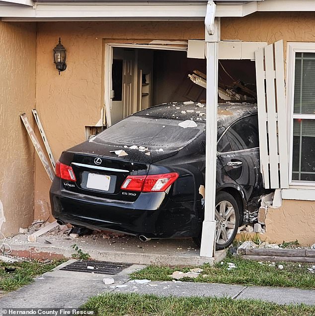 The black Lexus crashed into a house in Spring Hill on Monday morning