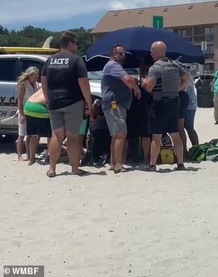 Beachgoers rushed to help after witnessing the deadly incident