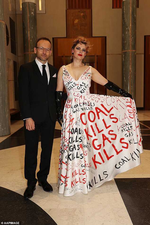 Greens leader Adam Bandt is pictured with his partner Claudia Perkins at the Federal Parliamentary Press Gallery's Midwinter Ball in the Great Hall of Parliament House.