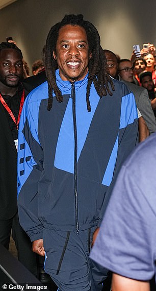 For the event he wore a two-tone blue tracksuit