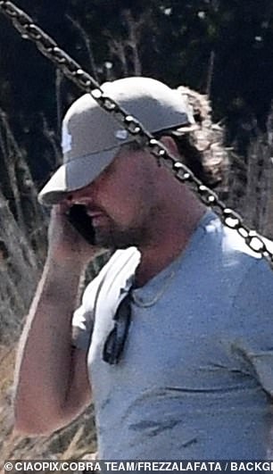 DiCaprio looked relaxed in knee-length khaki shorts and a matching T-shirt. The Oscar winner wore flip-flops and kept his appearance understated with a green hat and sunglasses.