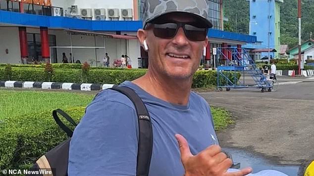 Jeremy 'Jezza' Wann, 48, died Thursday while surfing in North Sumatra province with his teenage son Mason and friends (the father of three is pictured)