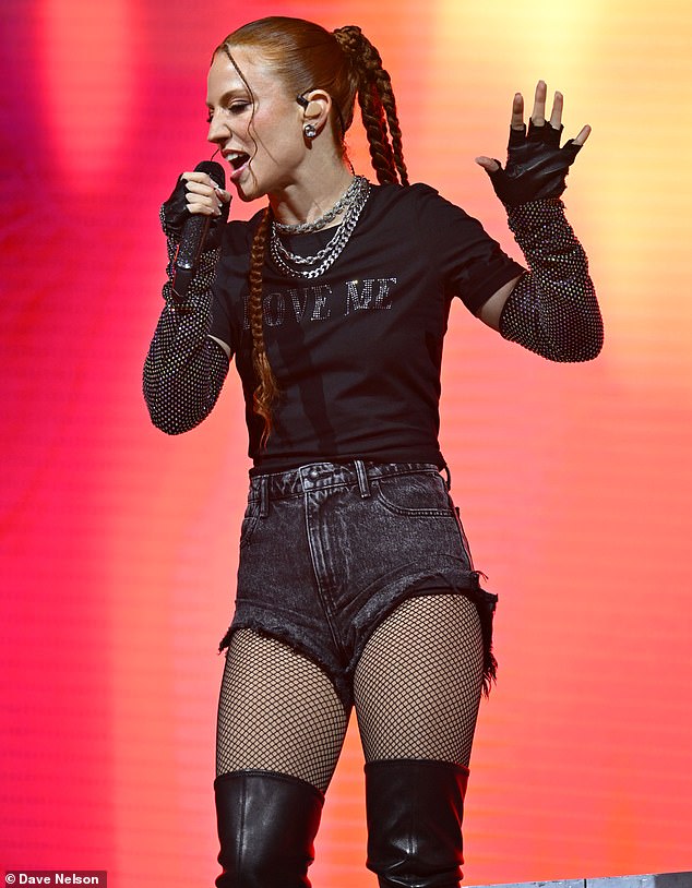 Jess Glynne, 34, channeled her inner rock chic in denim shorts and fishnet tights on Friday as she performed at Trentham Live 2024