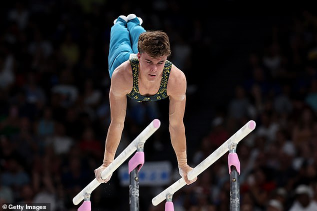 South Australian gymnast Jesse Moore is pictured competing on the parallel bars in Paris, where he added a quintessentially Australian touch to his preparation