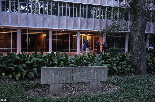 Police officers respond to an apparent murder-suicide at Jones College, a boarding school of Rice University