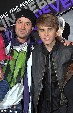 Justin Bieber's father is celebrating his first grandfatherhood, following the birth of the singer and wife Hailey's baby, Jack (pictured in Toronto in January 2011)