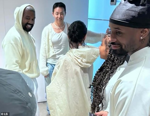 Kanye West showed up in Seoul with his 11-year-old daughter North and wife Bianca Censori (center) — who was unusually dressed in a beige hooded cape