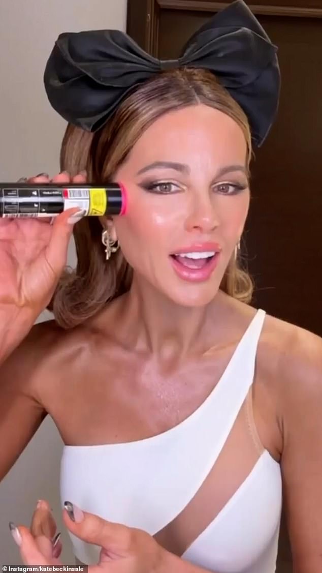 Kate Beckinsale, 51, set temperatures soaring in a white Norma Kamali swimsuit when she shared a glimpse of her flawless beauty regime in a hilarious social media video on Friday