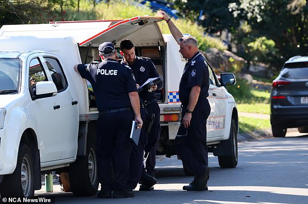 Police officers and forensic units remain on site