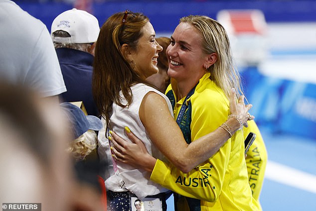 The quartet had a very famous fan in Queen Mary of Denmark - a distant relative of Ariarne Titmus - who celebrated with the gold medal winners after the race (pictured)