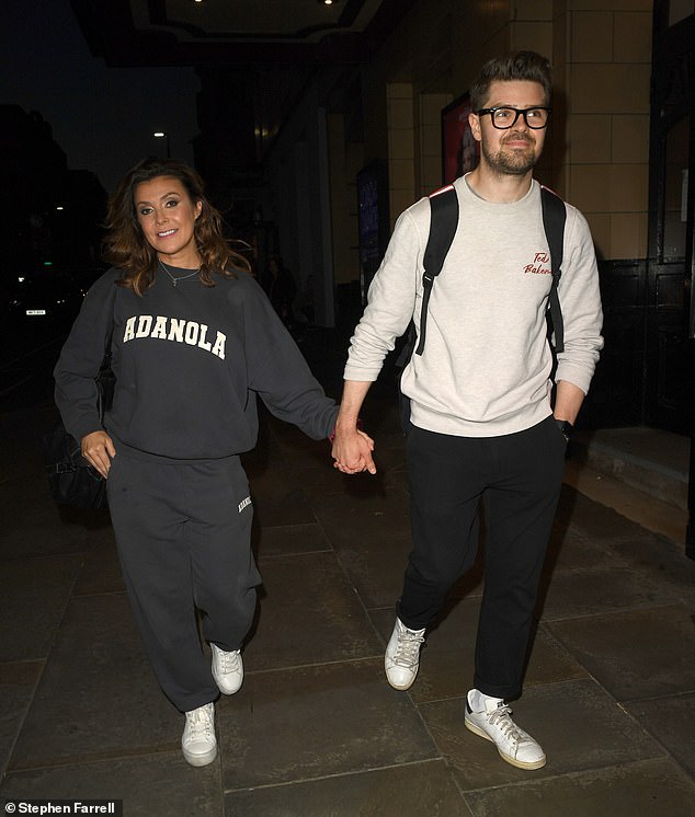 Kym Marsh and her toyboy boyfriend Samuel Thomas put on a loving show as they left another performance of 101 Dalmatians at The Palace Theatre in Manchester on Friday