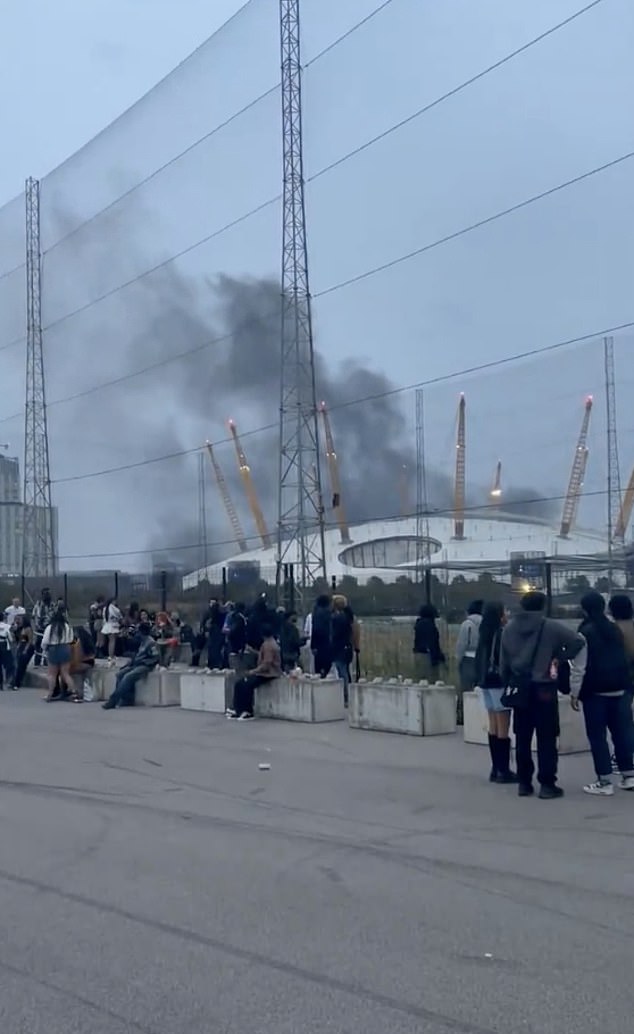 'Loud bangs and explosions' have been heard near the O2, while videos show huge plumes of smoke billowing into the air