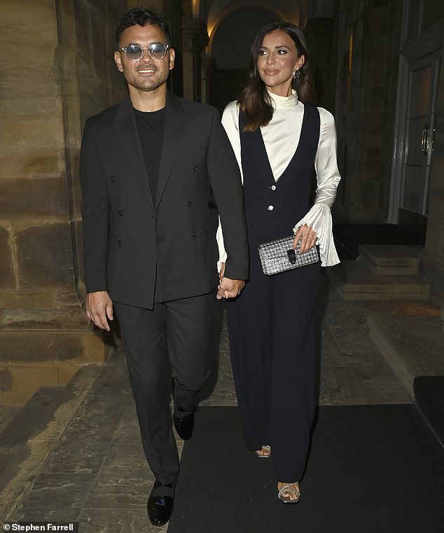 Ryan Thomas, 40, and Lucy Mecklenburgh, 33, look loved up in matching black outfits as they head out for dinner in Manchester on Thursday