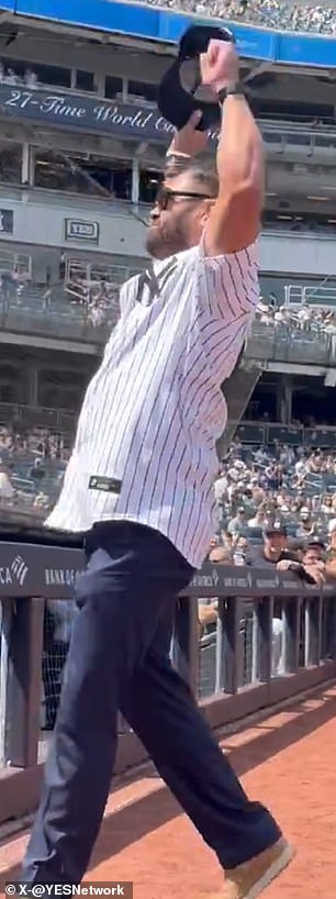 Johnny Damon raises his arms during Yankees' Old Timers' Day