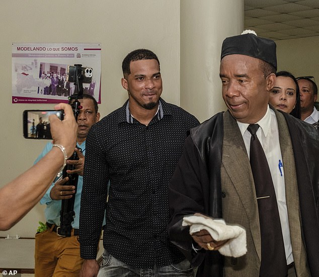 Franco (laughing) leaves the court with his lawyer Teodosio Jaquez (right) in Puerto Plata