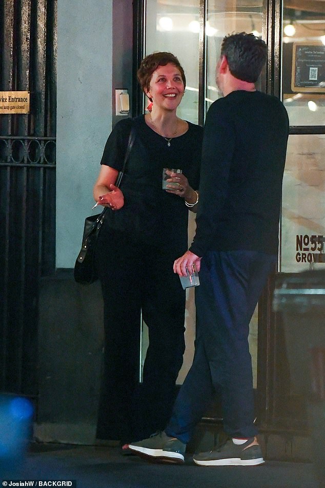 Maggie Gyllenhaal looked cheerful as she headed to dinner at Via Carota restaurant in New York City on Monday