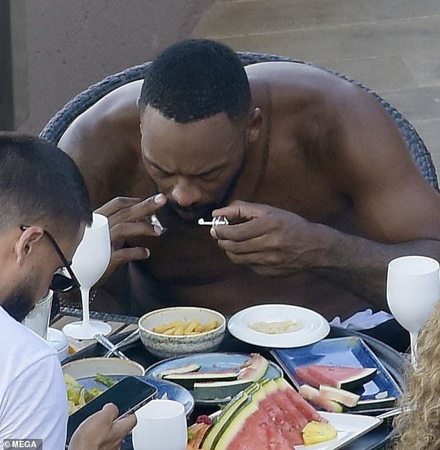 Marcus Jordan appeared to snort a white powdery substance while enjoying a poolside lunch with girlfriend Ashley Stevenson this week