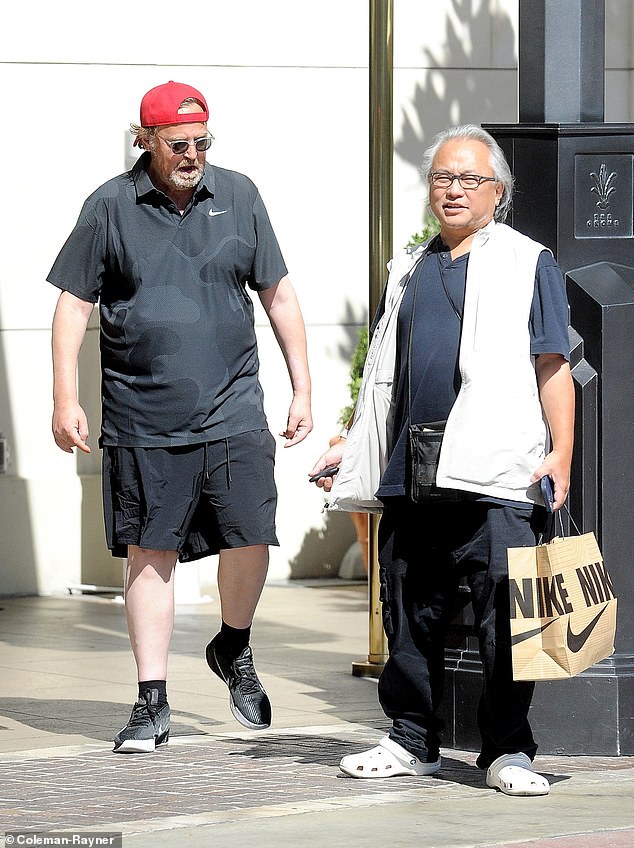 Matthew Perry had an aide and caregiver at his home, 59-year-old Kenny Iwamasa (pictured together in August) admits giving the late Friends star the ketamine that killed him. He 