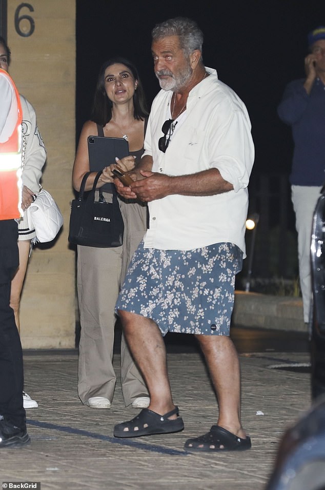 Mel Gibson enjoyed a night out with his family at Malibu's sushi restaurant Nobu; behind him is his girlfriend Rosalind Ross, 34