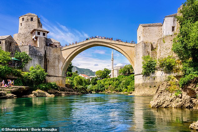 Before jumping from the 16th century Ottoman bridge, Mr Theobald had been trained by the diving club that operates at the popular tourist attraction