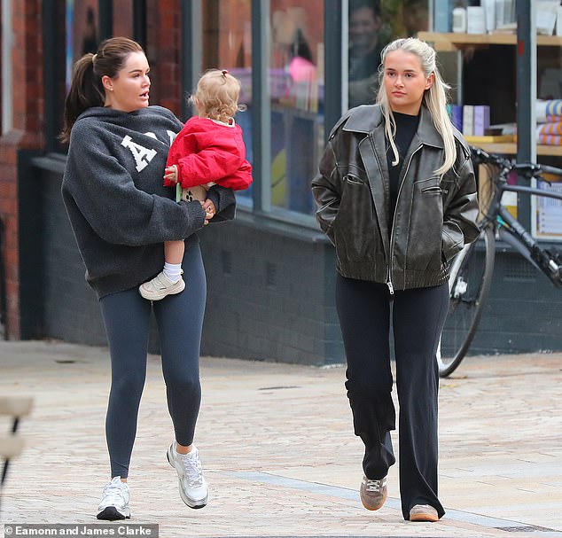 Molly-Mae Hague appeared to be in good spirits as she headed out for lunch with a friend and daughter Bambi in Altrincham on Sunday after announcing her shock split from fiancé Tommy Fury