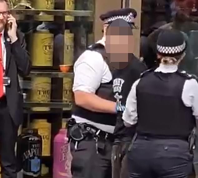 This is the moment a 'knife man' was arrested after a schoolgirl and her mother were attacked in Leicester Square