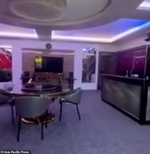 Footage shows agents opening a hidden door leading to an ornate lounge, accessed through a maze of secret passages in a cathedral on Quiboloy's 75-hectare property in Davao City (pictured: one of the hidden lounges)