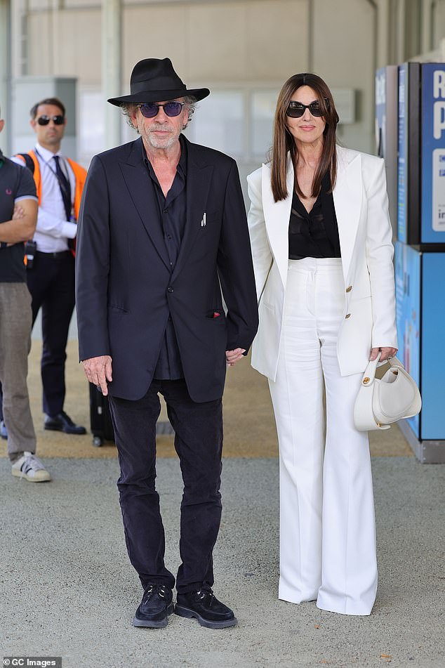 Monica Bellucci looked effortlessly chic as she walked hand-in-hand with Tim Burton at the Venice Film Festival on Tuesday ahead of the screening of Beetlejuice