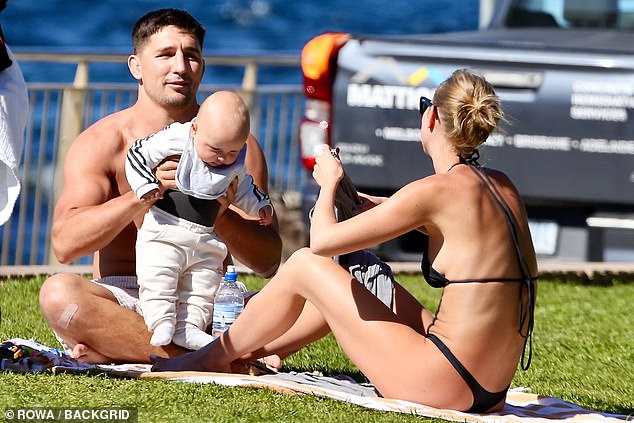 NRL star Victor Radley looked excited to embrace fatherhood on Tuesday as he visited Bronte Beach in Sydney with wife Taylah and their newborn son Vinnie. All pictured